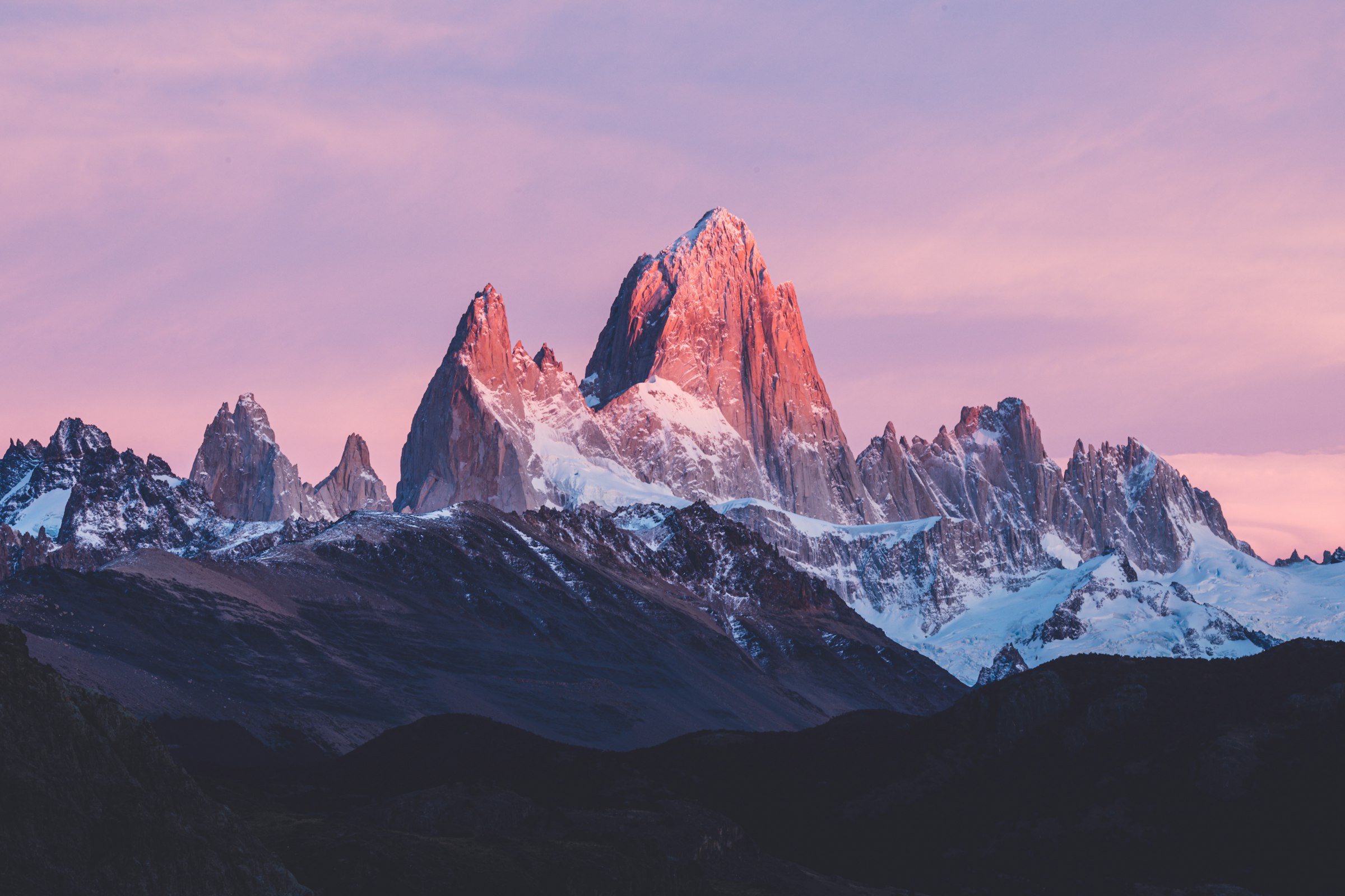 Fitz Roy massif in Patagonia at dusk under a soft pink sky